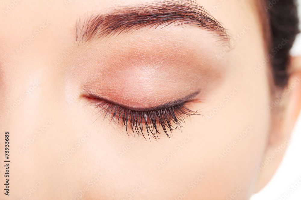 Obraz premium Close up on woman eye with an artistic makeup