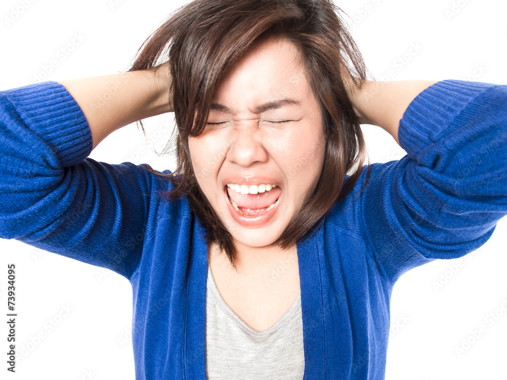 Young stress woman going crazy pulling her hair in frustration o Young stress woman going crazy pulling her hair in frustration o