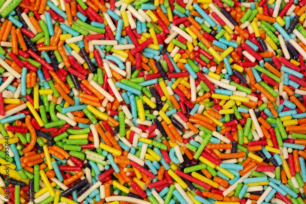 Colorful small sweet sugar sticks decoration background