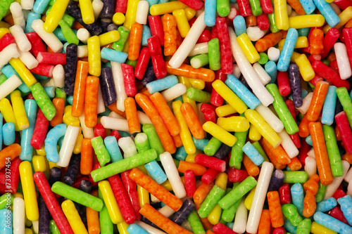 Colorful small sweet sugar sticks close-up background