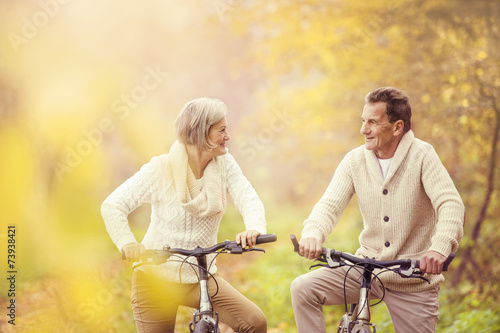 Active seniors riding bike