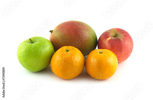 Ripe appetizing fruits: mango, apples and tangerines isolated