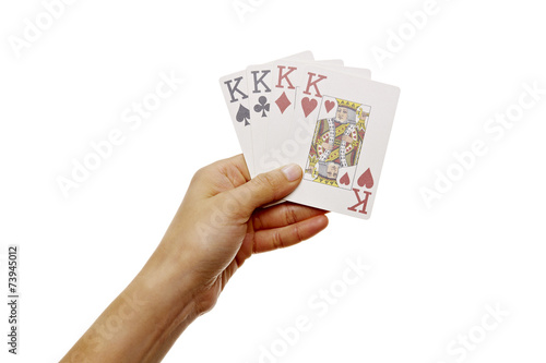Hand hält vier Könige