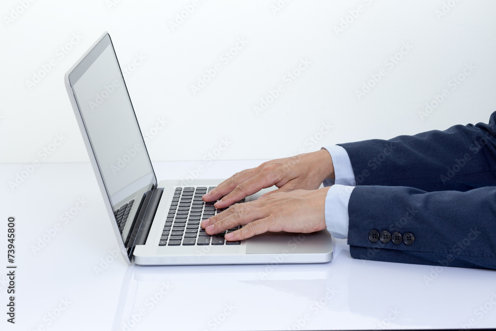 Businessman hands typing on laptop computer Businessman hands typing on laptop computer