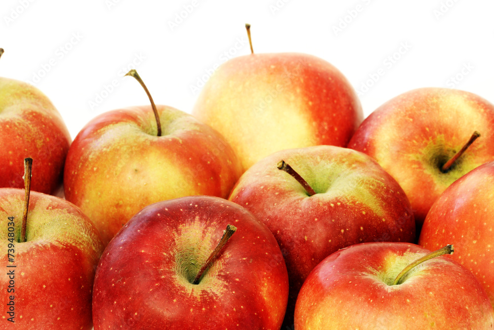 A lot of red apples close up on white background A lot of red apples close up on white background