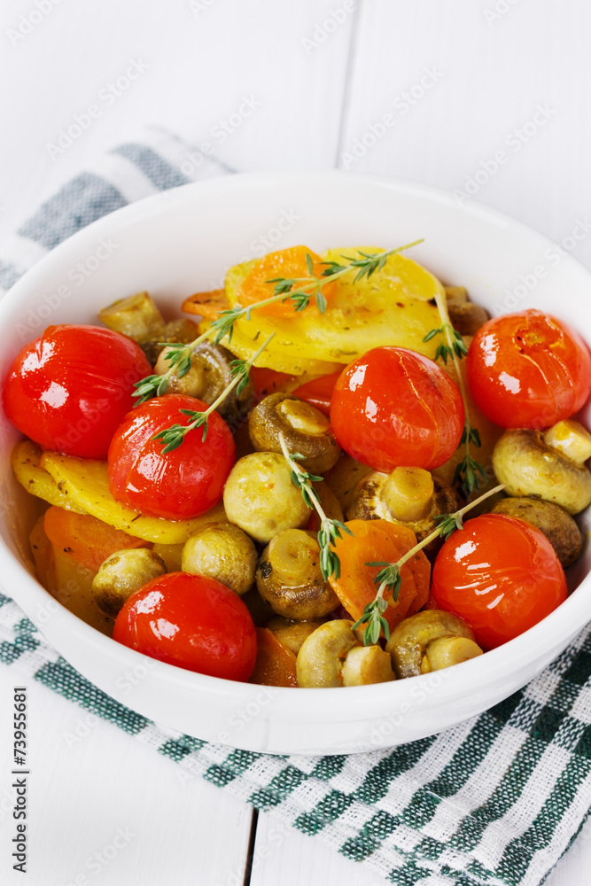 baked potatoes with carrots, mushrooms and cherry tomatoes