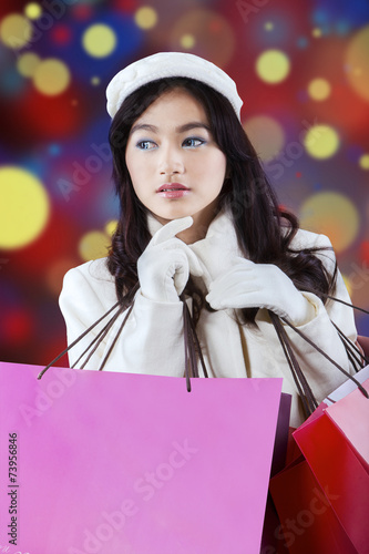 Elegant teenage girl with shopping bags