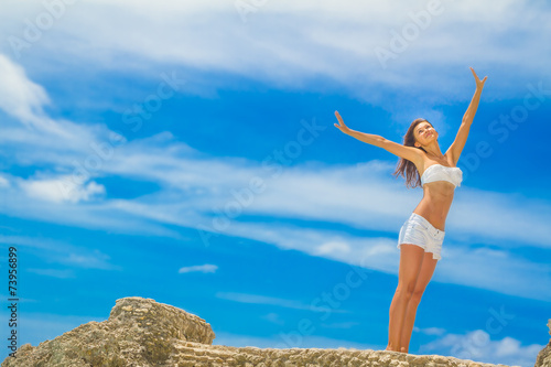 young happy beautiful woman outdoor portrait, beach and sky back
