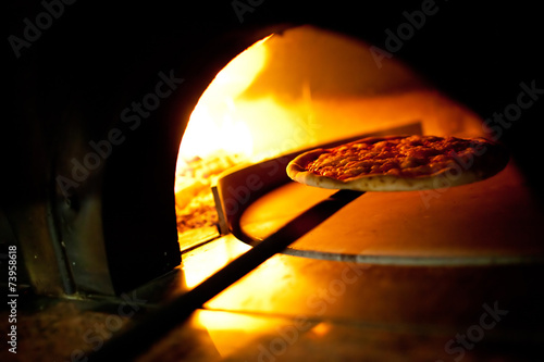 A pizza in a oven burning