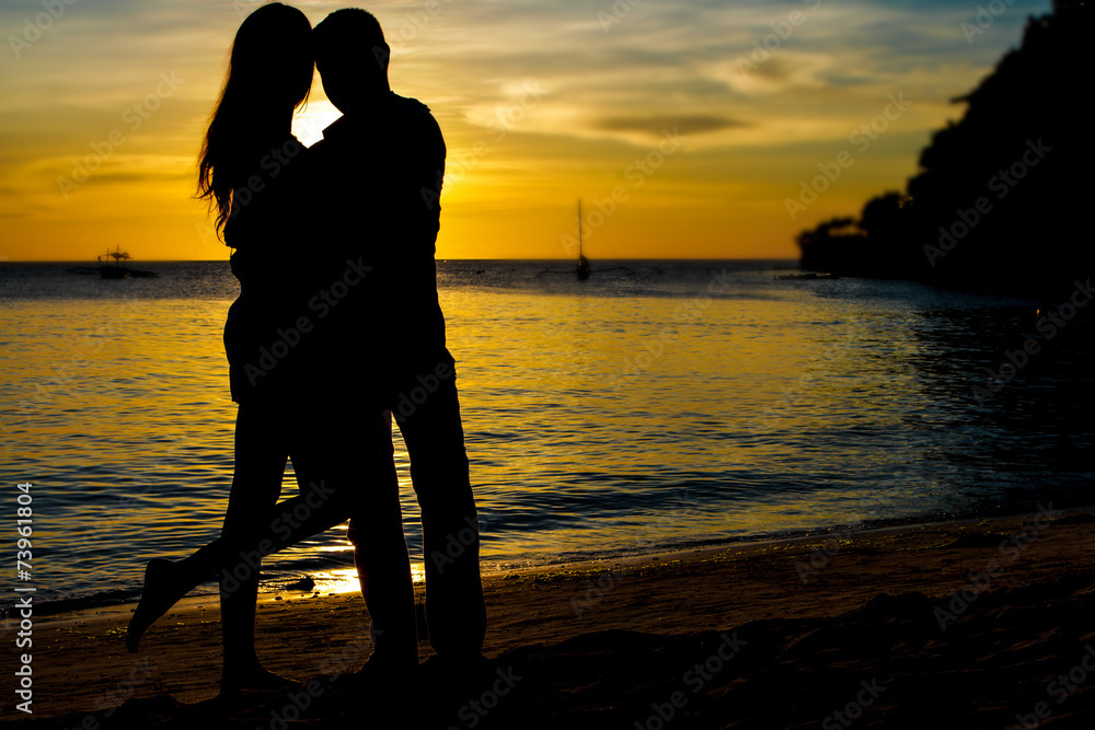 young loving couple on wedding day on tropical beach and sunset
