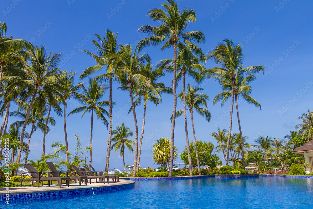 luxury pool in a hotel, resort leisure time, relaxing near the p