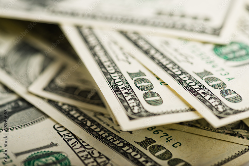 Fototapeta premium Stack of one hundred dollar bills close-up