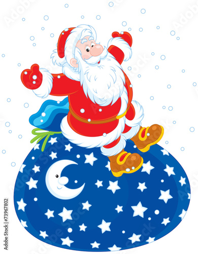 Santa Claus sitting on his big bag of Christmas gifts