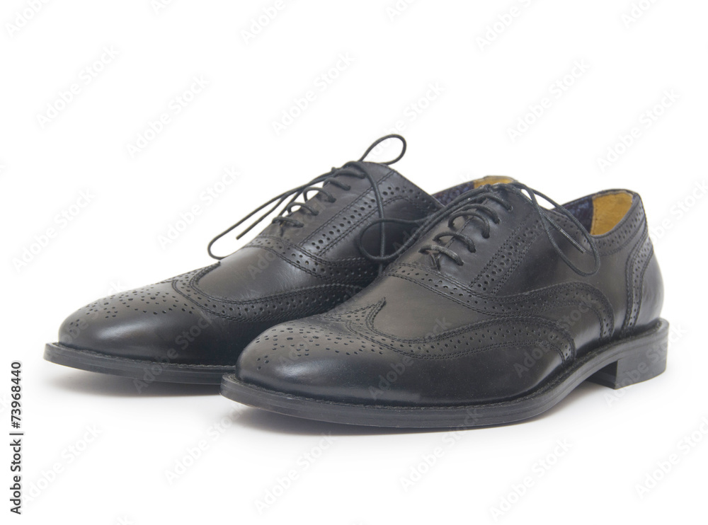 Close-up of mens shoes on white background