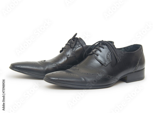 Close-up of mens shoes on white background
