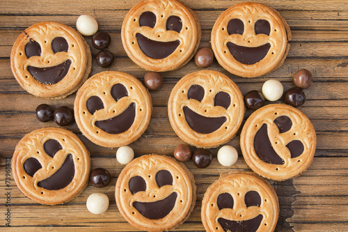 Картината върху платно Round smiling chocolate cookies with chocolate balls