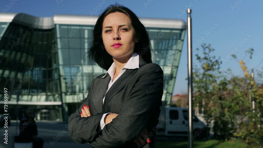 Businesswoman cross arms and doing serious look to the camera Businesswoman cross arms and doing serious look to the camera