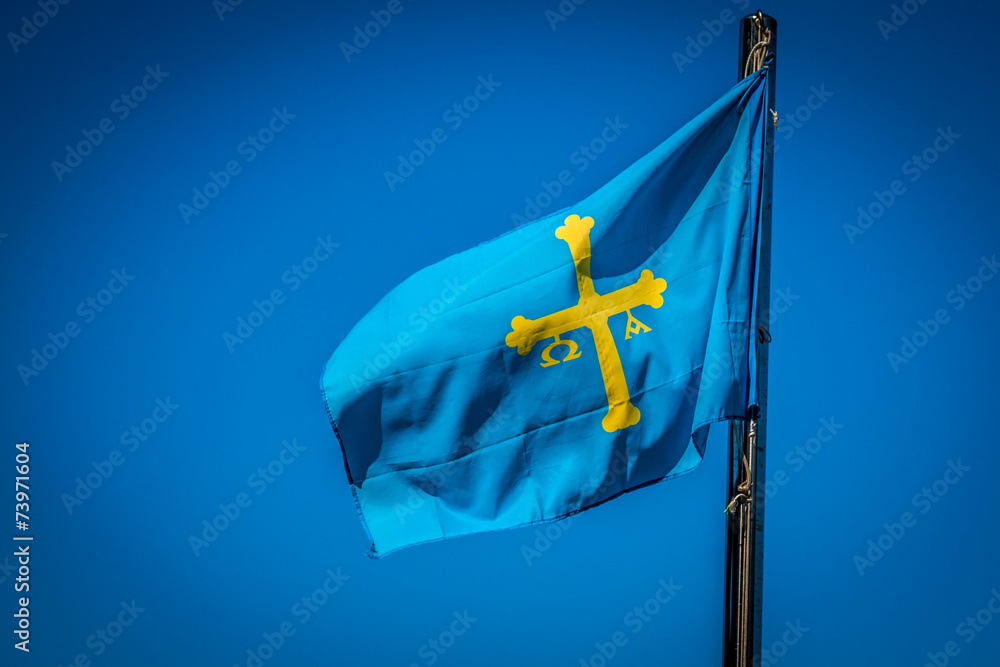 Flag of Spanish Asturias Autonomous community waving in the wind