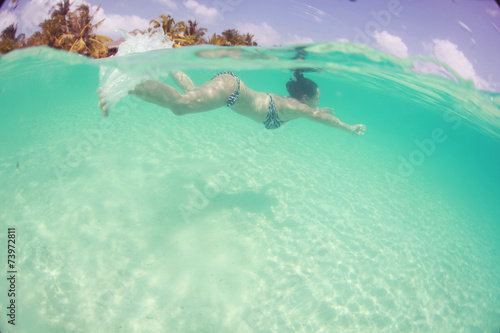 woman swimming in the ocean  diving