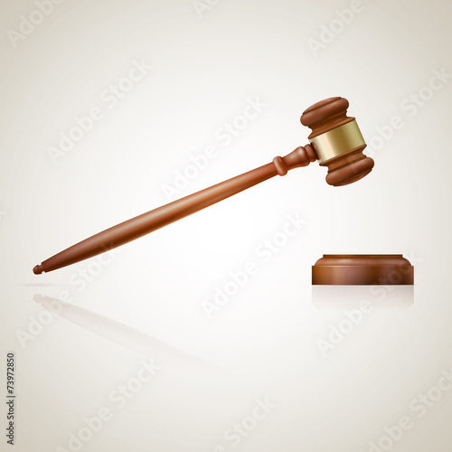 A wooden judge gavel and soundboard