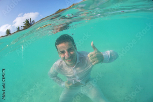 Guy swimming in the ocean , diving © hreniuca