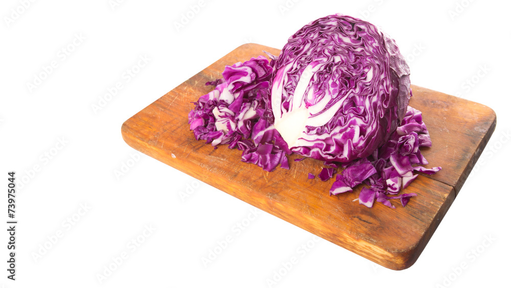 Fototapeta premium Chopped red cabbage on cutting board over white background