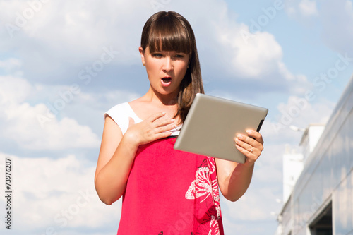 Beautiful woman using tablet photo