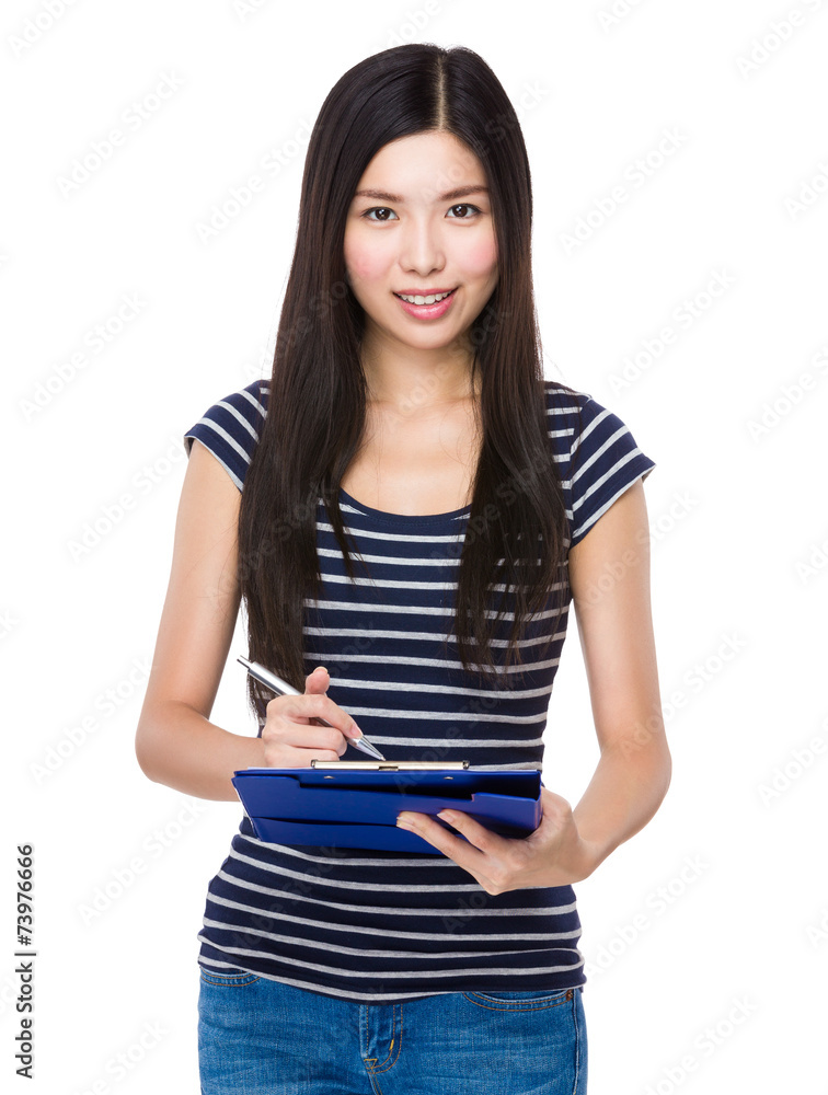 Fototapeta premium Woman take note on clipboard