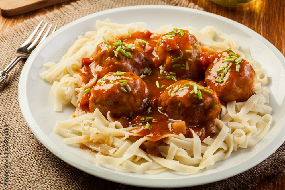 Pasta fettuccine and meatballs with tomato sauce