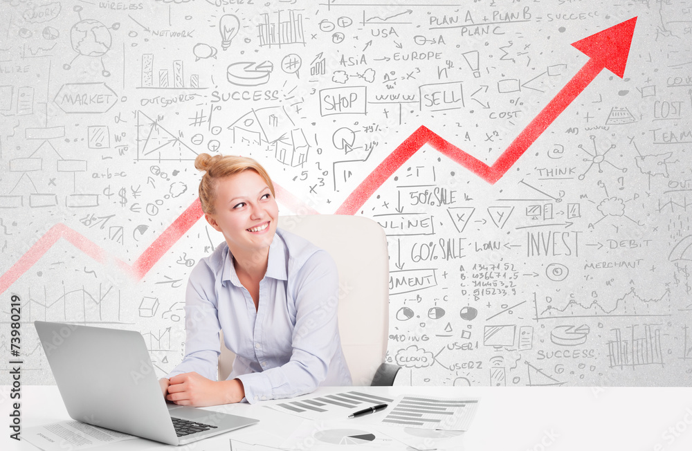 Business woman sitting at table with market diagrams Business woman sitting at table with market diagrams