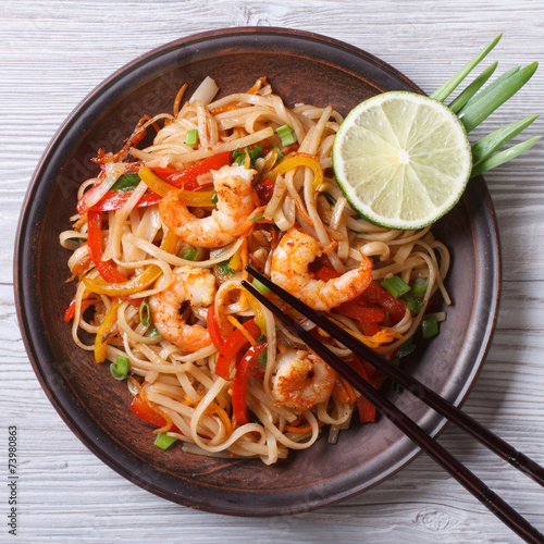 Delicious rice noodles with shrimp and vegetables  top view