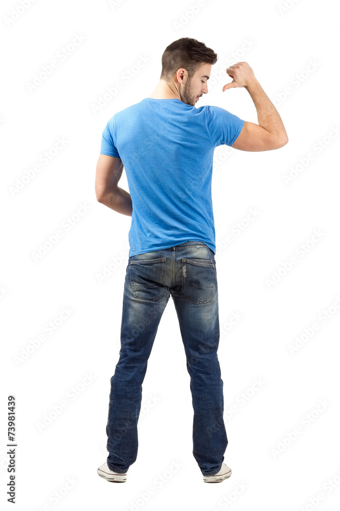 Man pointing with thumb on shirt. Rear view. Man pointing with thumb on shirt. Rear view.