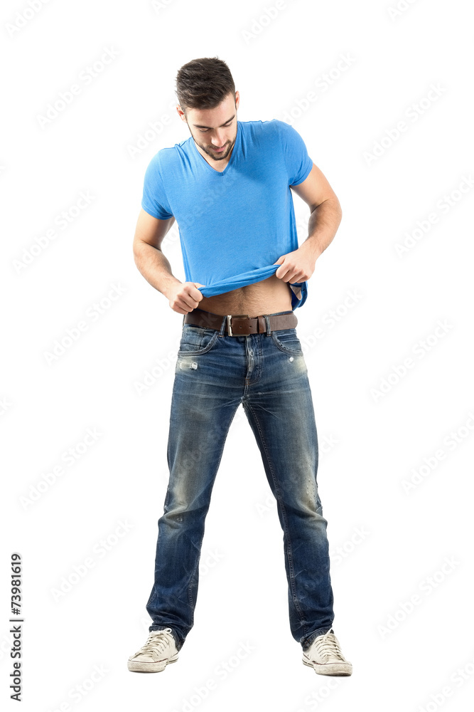 Man putting on shirt isolated Man putting on shirt isolated