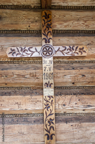 Wooden cross next to front door to Jaszczurowka Chapel - Poalnd. photo