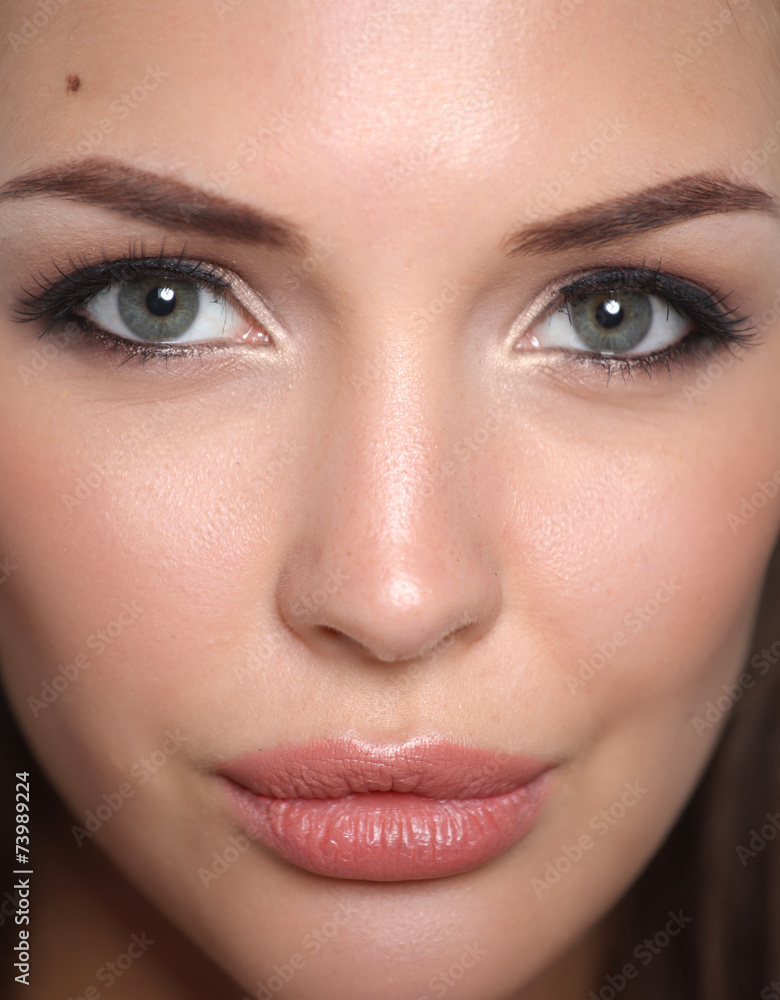 Close up portrait of beautiful young woman face. Isolated on Close up portrait of beautiful young woman face. Isolated on