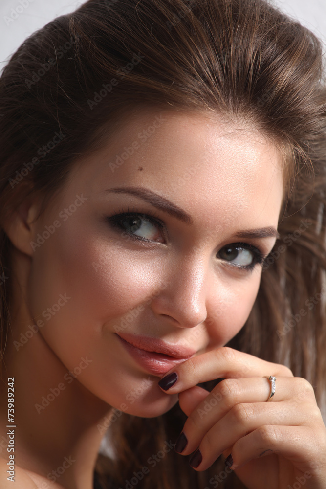 Obraz premium Close up portrait of beautiful young woman face. Isolated on