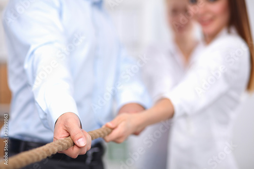 Concept image of business team using a rope as an element  the photo