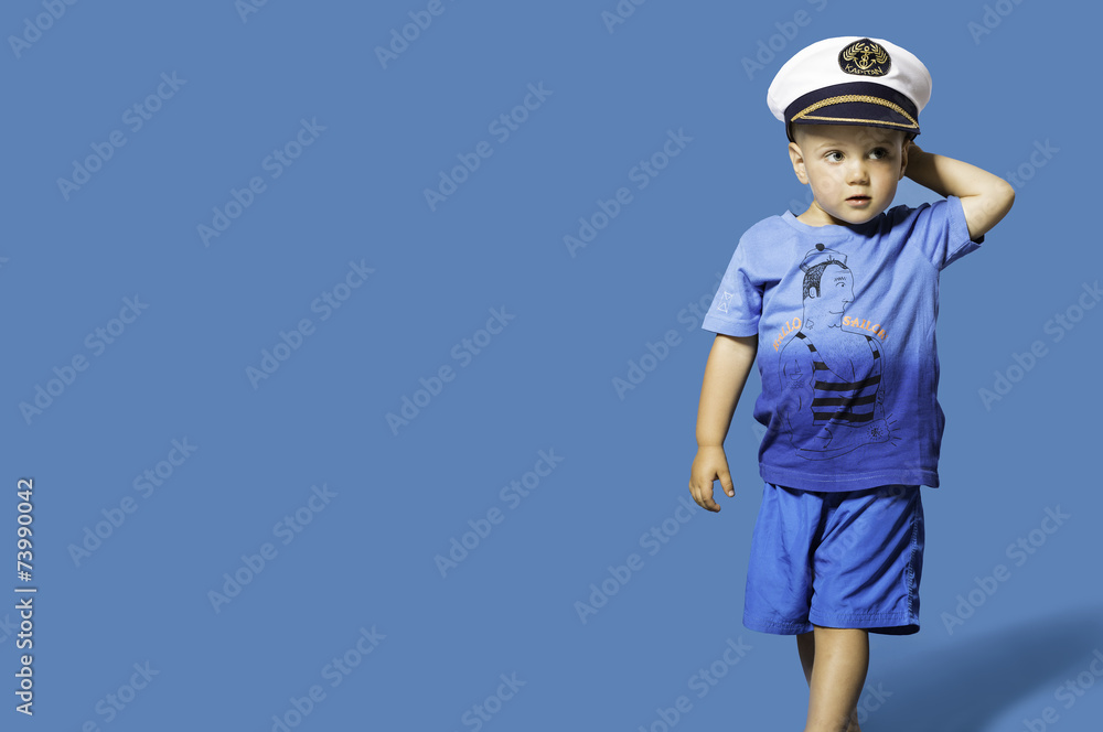 Fashionable little blond boy wearing sailor hat Fashionable little blond boy wearing sailor hat