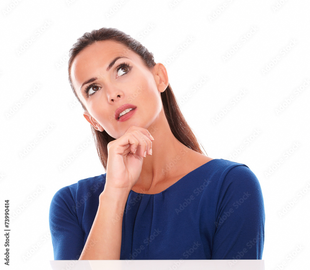 Woman in blue blouse looking up Woman in blue blouse looking up