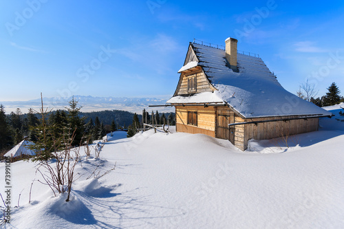 Wooden house in Gorce Mountains in winter time, Poland