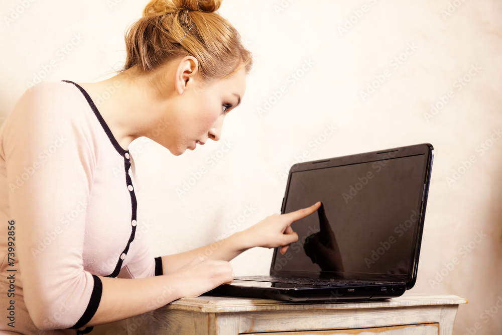 Businesswoman touching screen computer laptop Businesswoman touching screen computer laptop