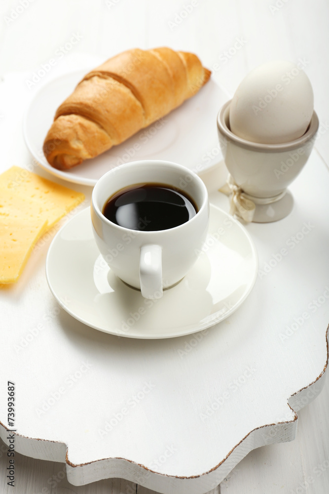 Delicious breakfast with coffee, fresh croissant, egg and Delicious breakfast with coffee, fresh croissant, egg and