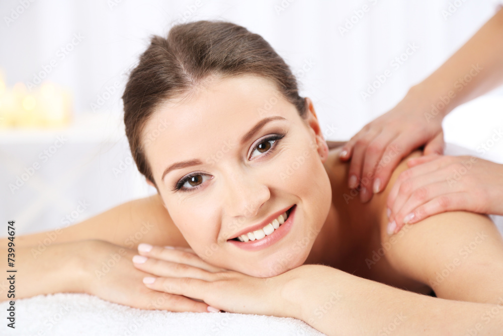 Beautiful young woman having massage in spa salon Beautiful young woman having massage in spa salon