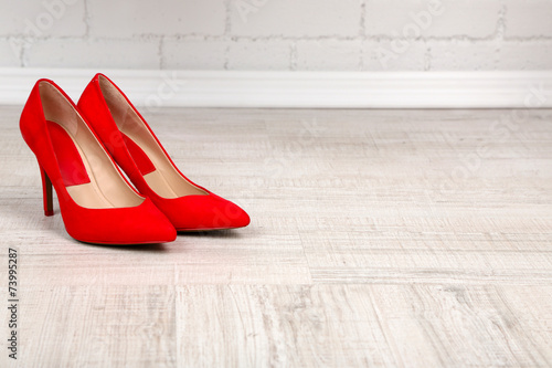 Red women shoes with on the floor