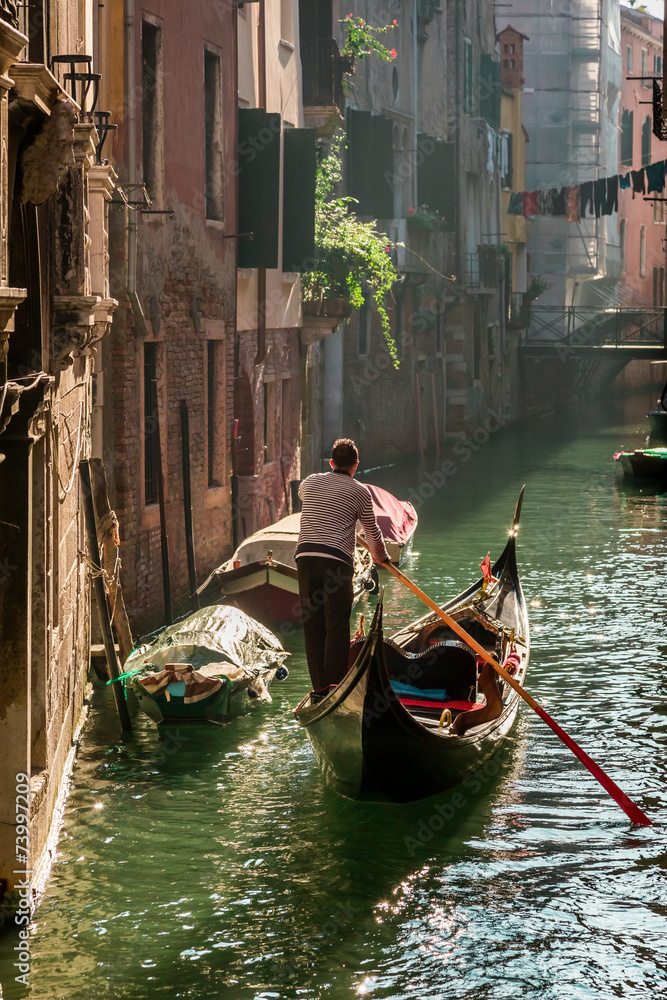 Lone gondolier in Venice Floating