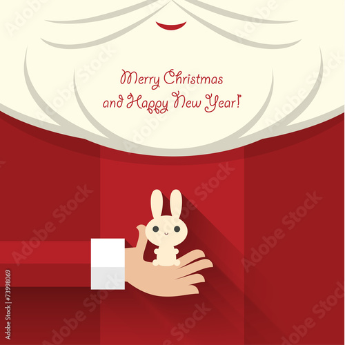 Santa Claus holds bunny