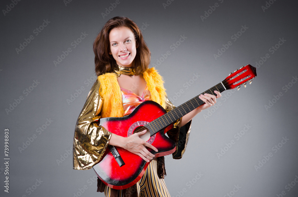 Guitar player with red instrument
