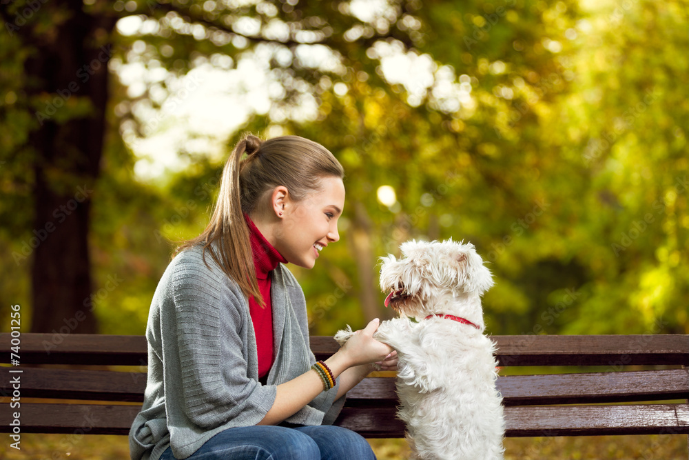 woman with her puppy in park woman with her puppy in park