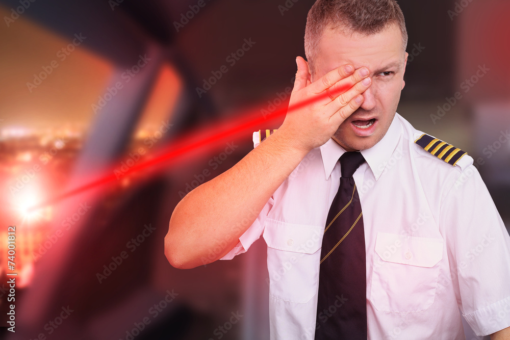 Landing plane and pilot blinded by laser beam Stock Photo | Adobe Stock