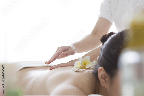 Women undergoing back massage